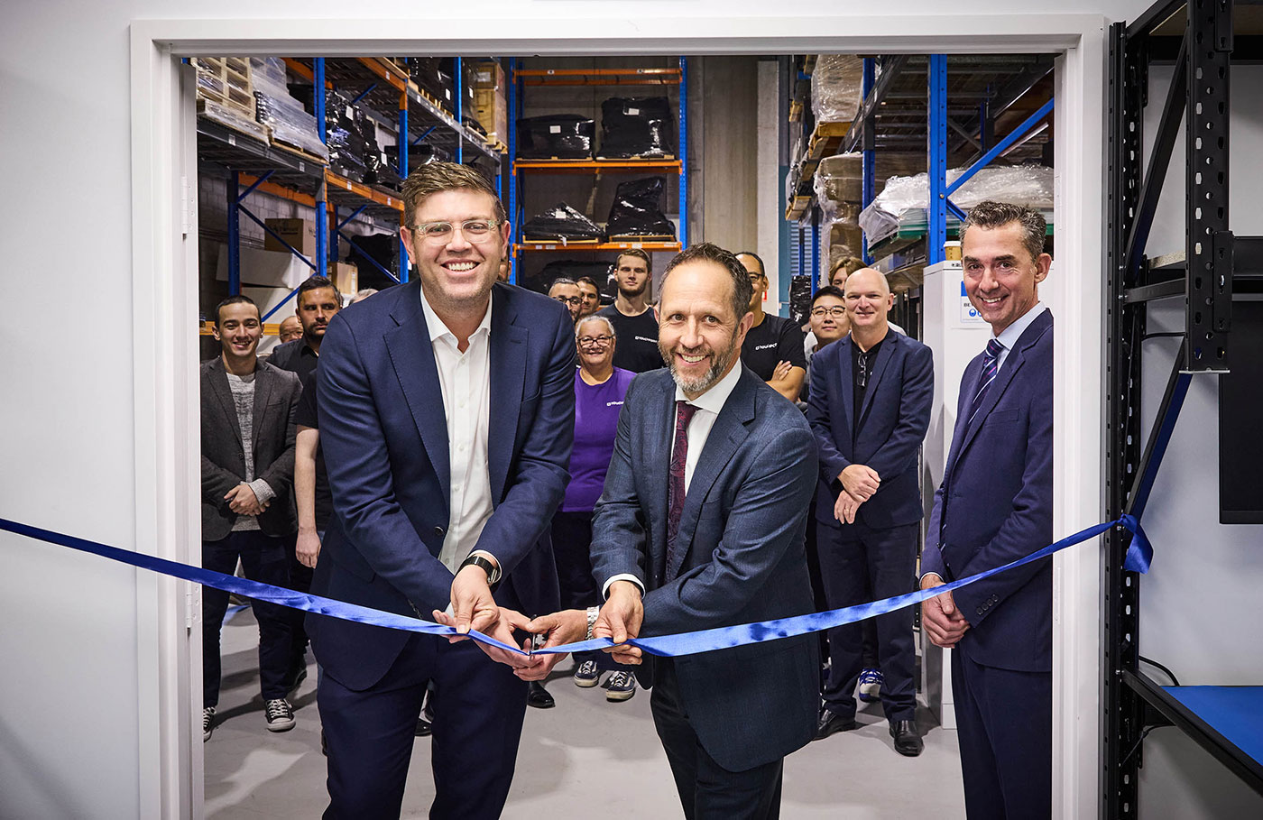 Jerome Laxale MP cutting the ribbon to open Touchpoint's Technical Centre with founders Bill Freeman and Nick Asscher